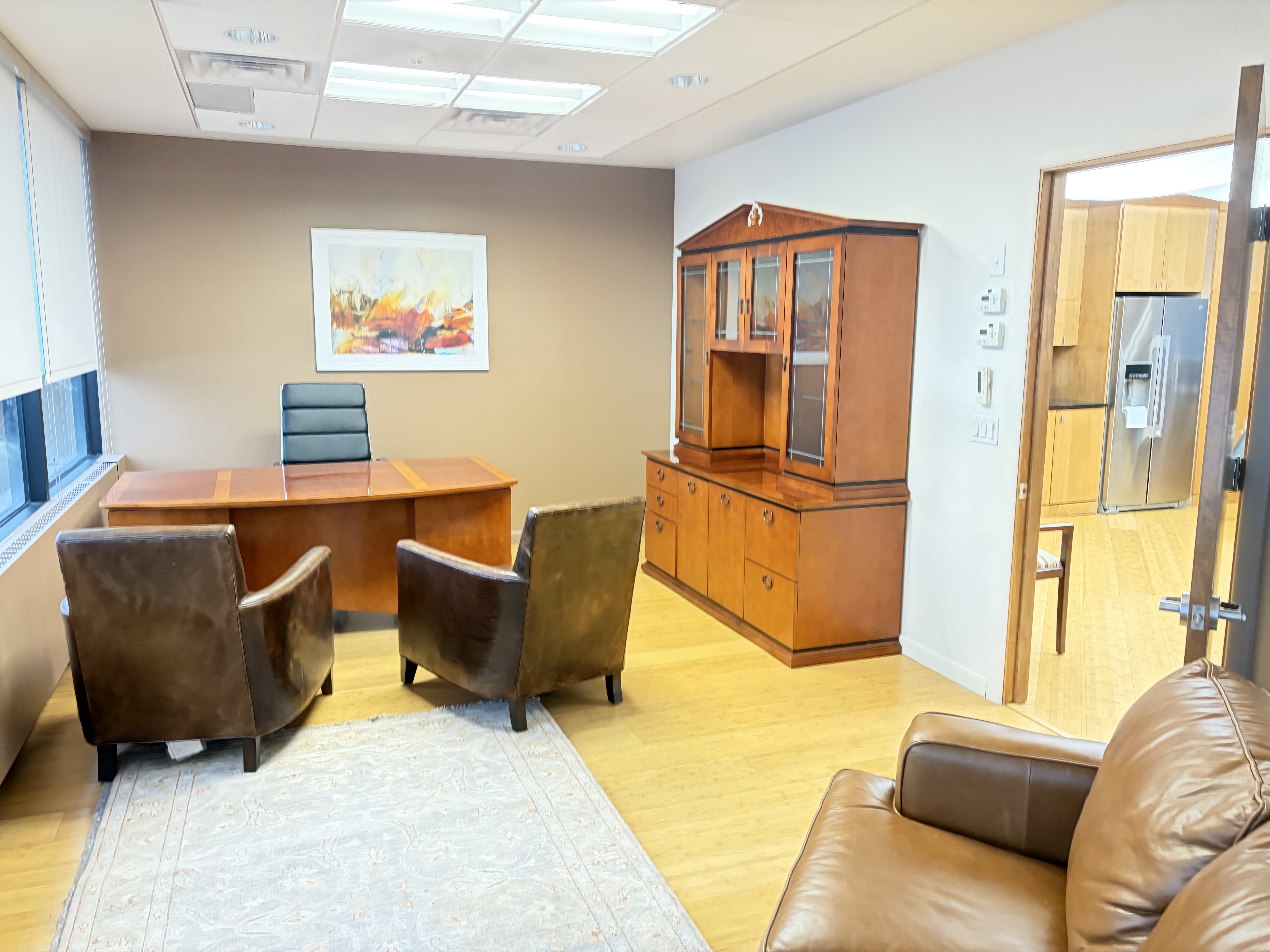 Executive office with desk and guest chairs