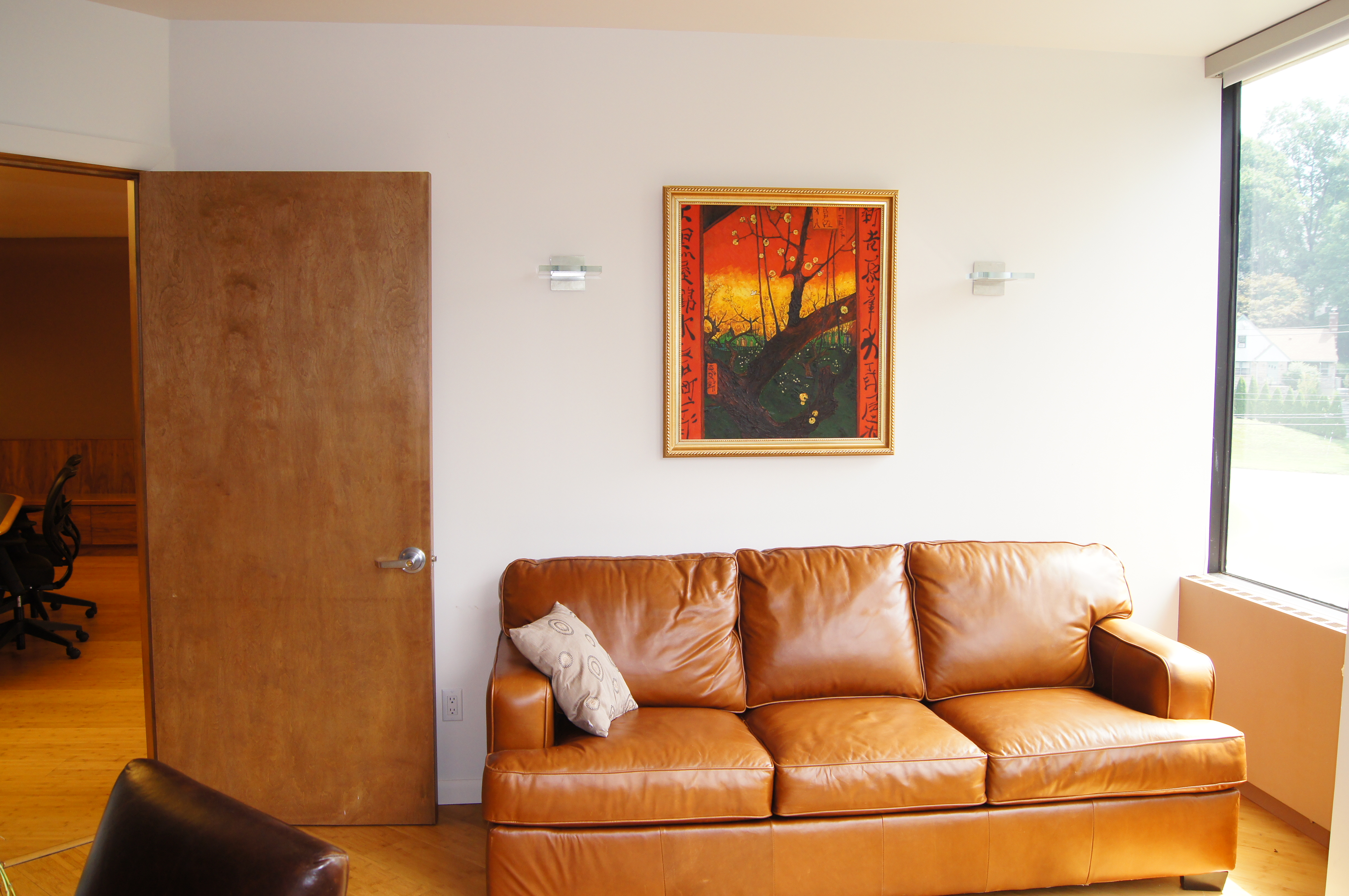 Private office lounge area with leather sofa
